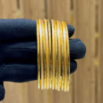 Goldplated bangles with gold polish